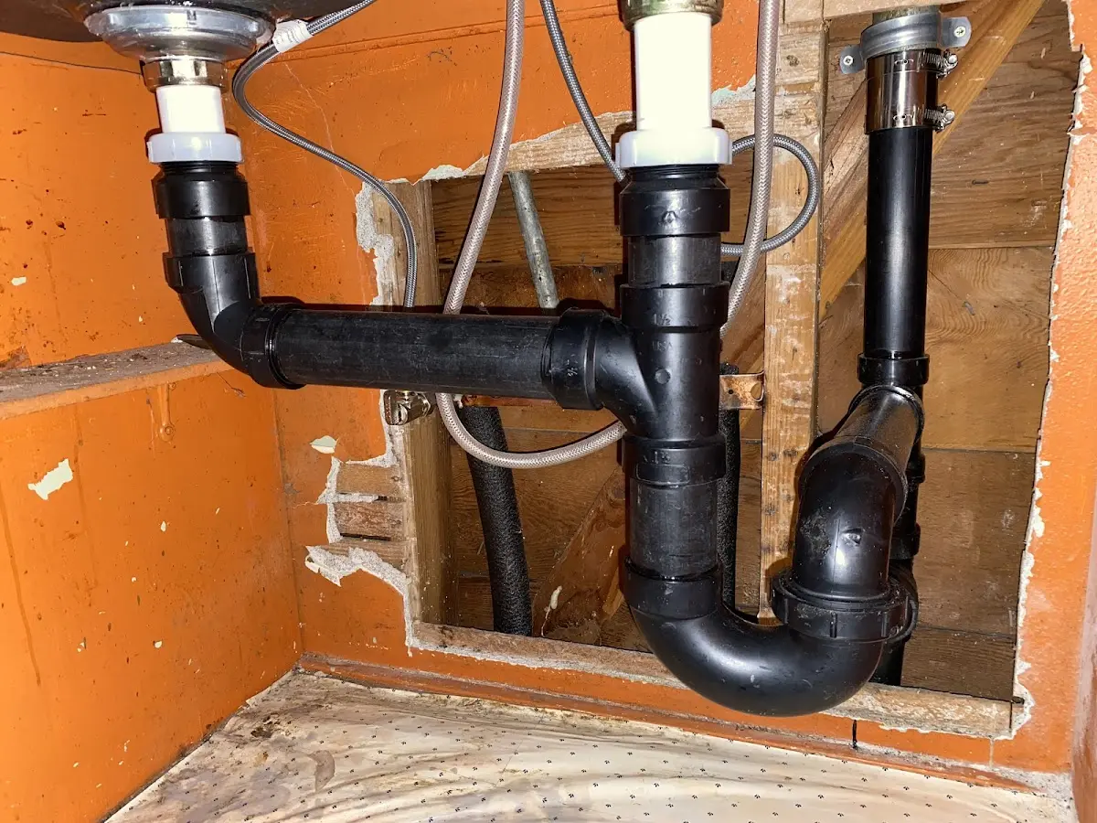 Professional Garbage Disposal Repair equipment and tools on the job in Llano